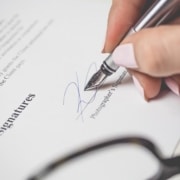 photo of a sales rep signing a contract