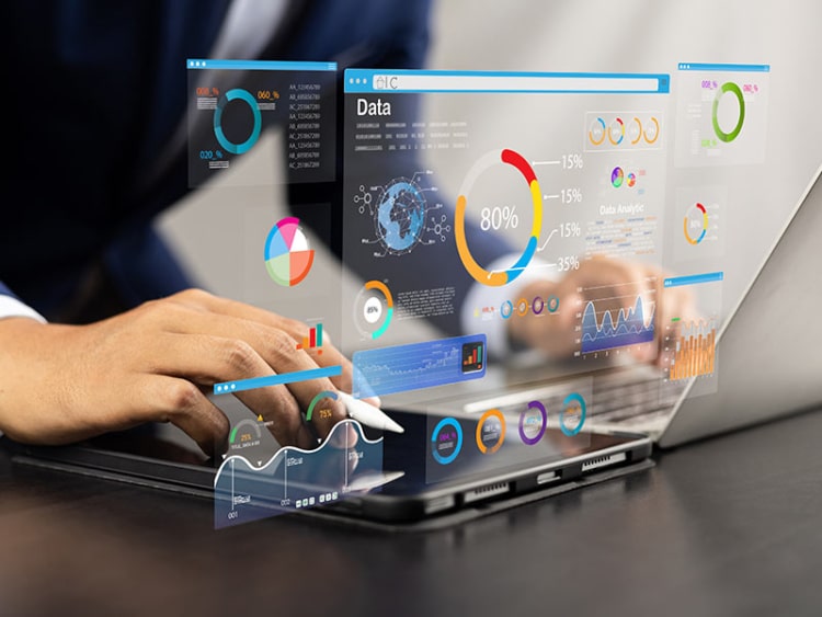 Analyst utilizing technology and dashboard to review data