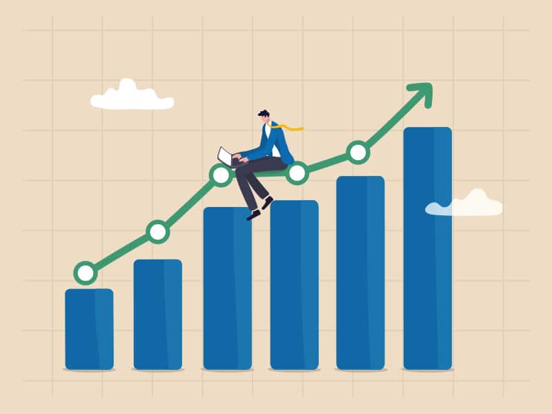 Salesman engaging with a sales app on his laptop, focused on enhancing his sales strategy and client interactions.